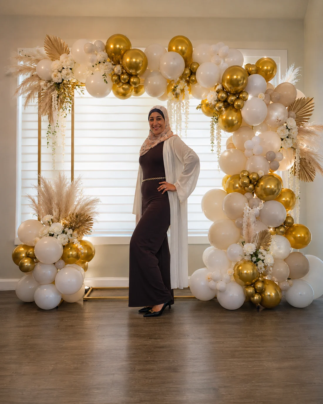 The founder of PopArch in front of one of her balloon installations
